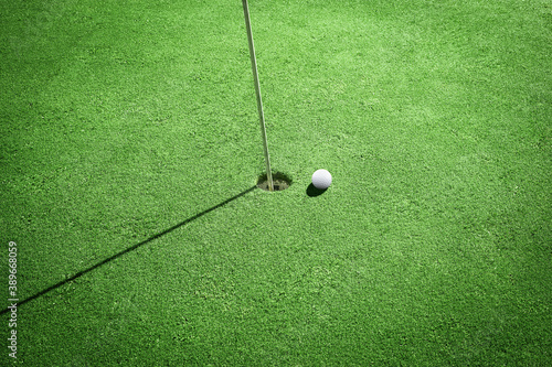 High angle close Up shooting golf Ball and Golf Flag