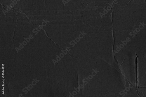 Black vintage rough sheet of carton. Recycled environmentally friendly cardboard paper texture. Simple gray minimalist papercraft background.