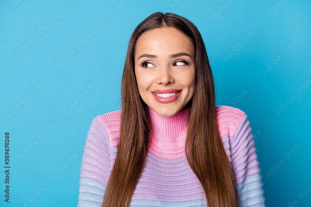 Close up photo of adorable nice girl look copyspace wear pullover isolated over blue color background Close up photo of adorable nice girl look copyspace wear pullover isolated over blue color background