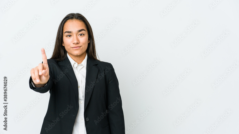 Young asian bussines woman isolated on white background showing number one with finger. Young asian bussines woman isolated on white background showing number one with finger.