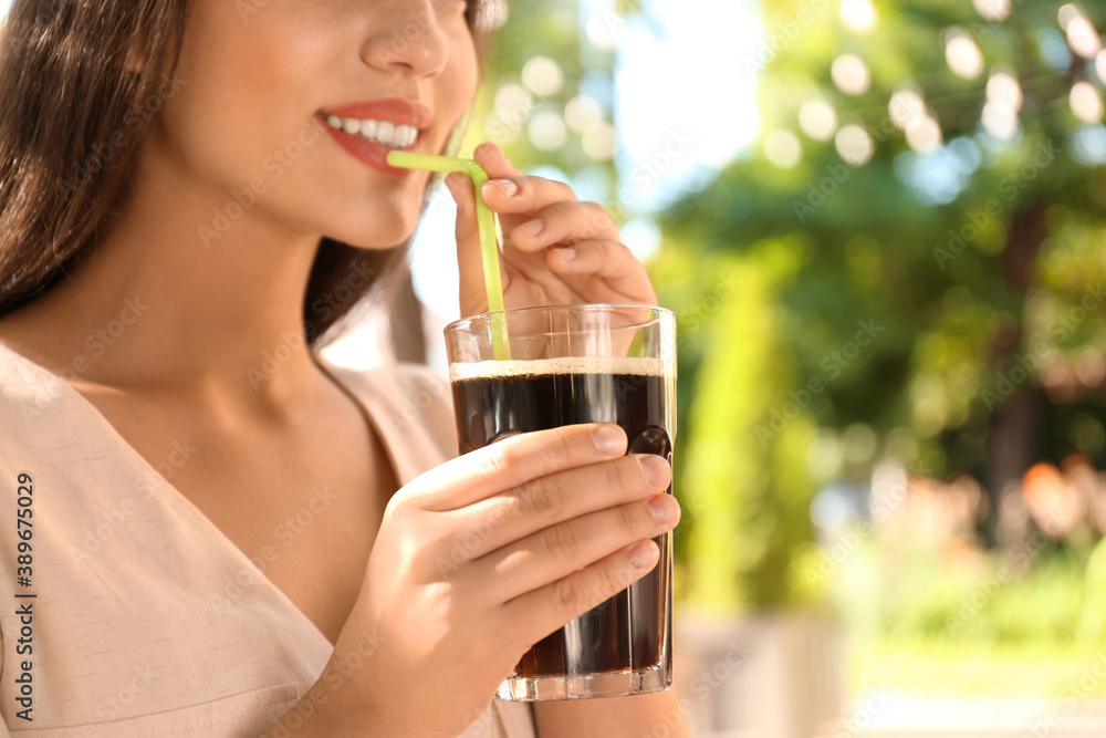 Young woman with cold kvass outdoors, closeup. Traditional Russian summer drink Young woman with cold kvass outdoors, closeup. Traditional Russian summer drink