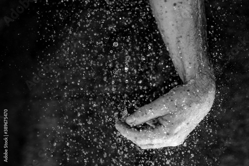 human hands with droplets 