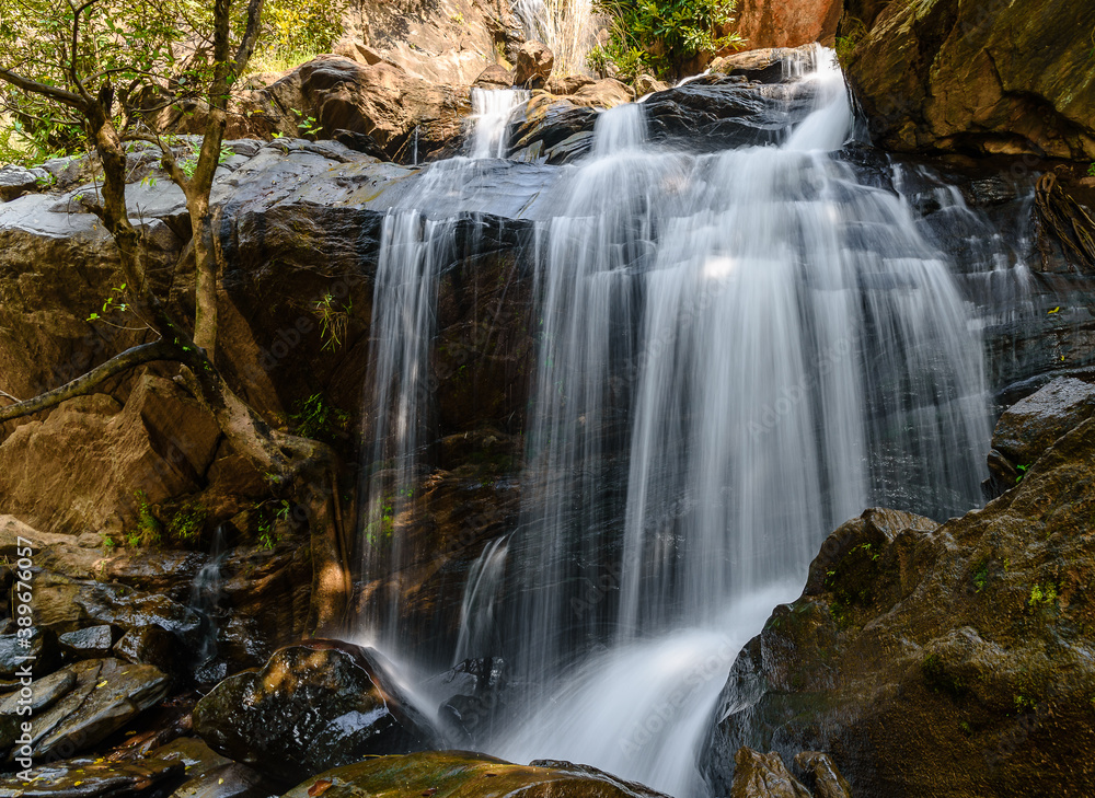 Bamni Waterfall is a A much spread-out waterfall and cascades over the rock face in three different stages.  Slow Shutter speed is used.