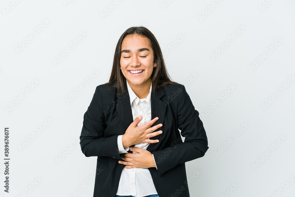 Young asian bussines woman isolated on white background laughs happily and has fun keeping hands on stomach. Young asian bussines woman isolated on white background laughs happily and has fun keeping hands on stomach.