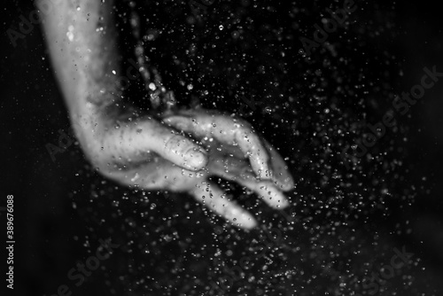 human hands with droplets 