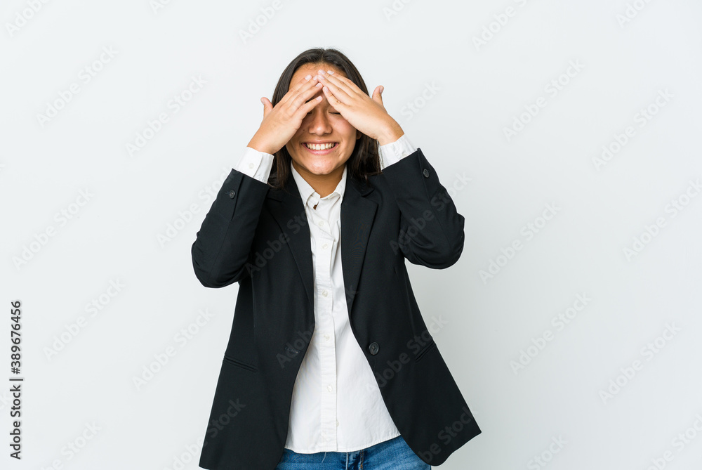Young asian bussines woman isolated on white background covers eyes with hands, smiles broadly waiting for a surprise. Young asian bussines woman isolated on white background covers eyes with hands, smiles broadly waiting for a surprise.