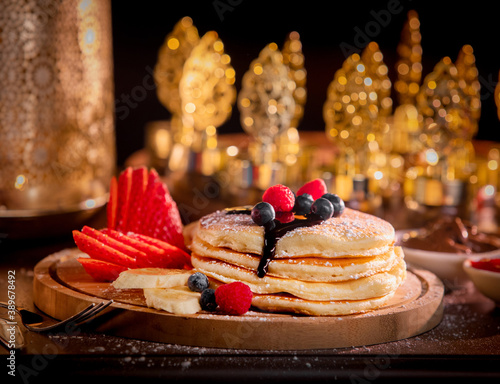 Golden Pancakes with Strawerry, Banana  and Blueberry photo