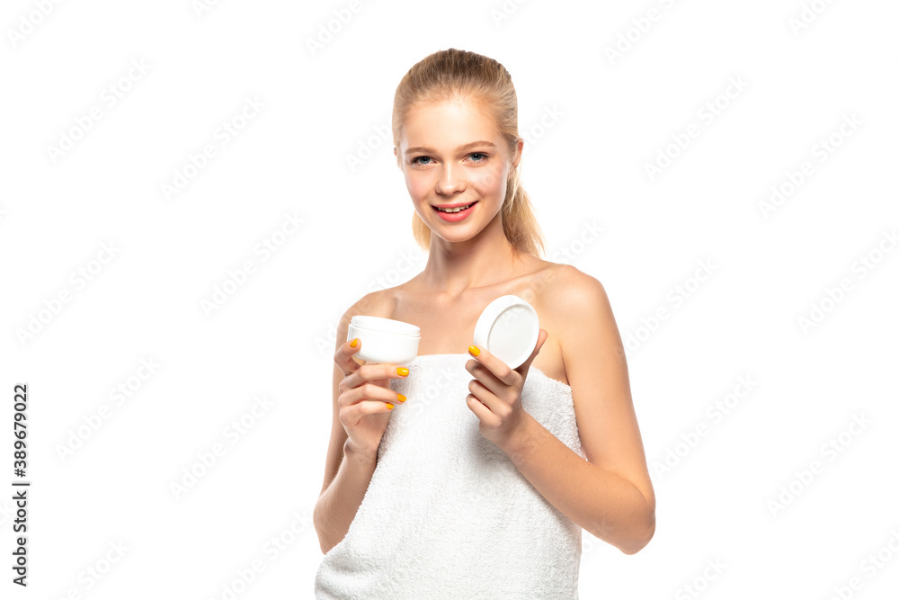 Moisturizer. Beautiful female model isolated on white background. Beauty, cosmetics, spa, depilation, diet and treatment, fitness concept. Fit and sportive, sensual body with well-kept skin in towel.