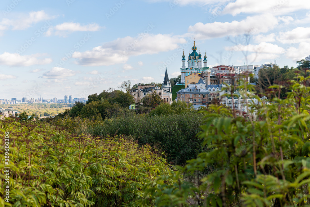 Kyiv (Kiev), Ukraine - October 8, 2020: Stunning view on the old and ancient tourist area in Kyiv, Saint Andrew's Church with prerevolutionary residential buildings