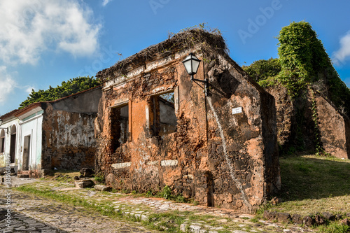 Ruins of an old building with vegetation in the historic city of Alcântara, Maranhão, Brazil.