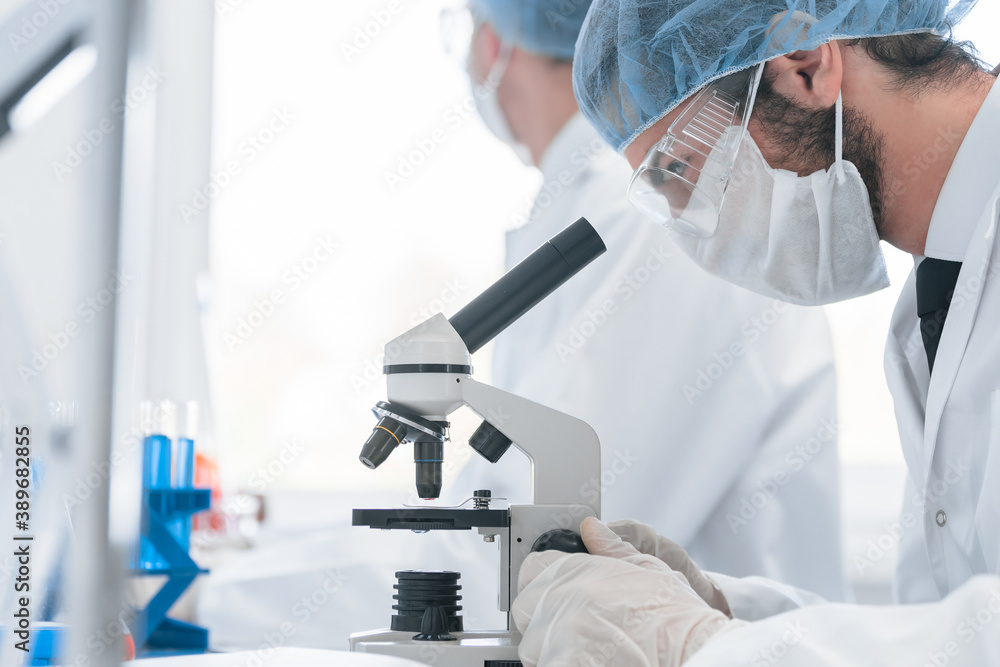 Fototapeta premium close up. a group of scientists working on creating a new vaccine.
