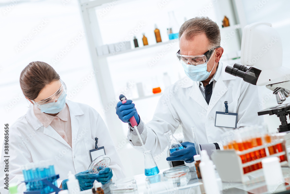 close up. scientists are testing a new vaccine. close up. scientists are testing a new vaccine.