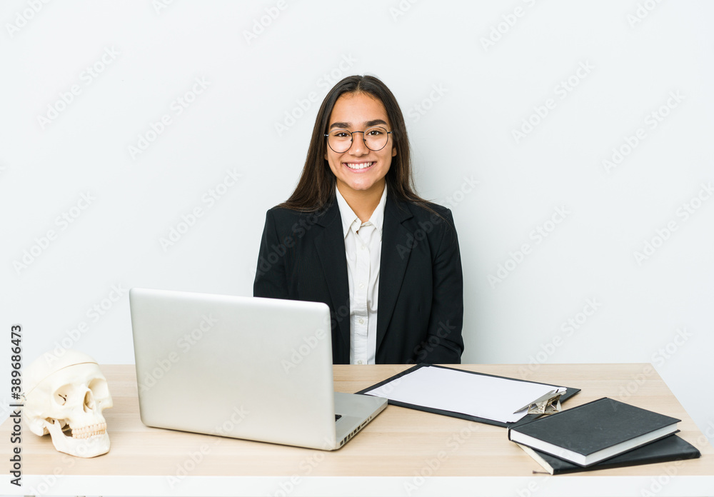 Young traumatologist asian woman isolated on white background happy, smiling and cheerful. Young traumatologist asian woman isolated on white background happy, smiling and cheerful.