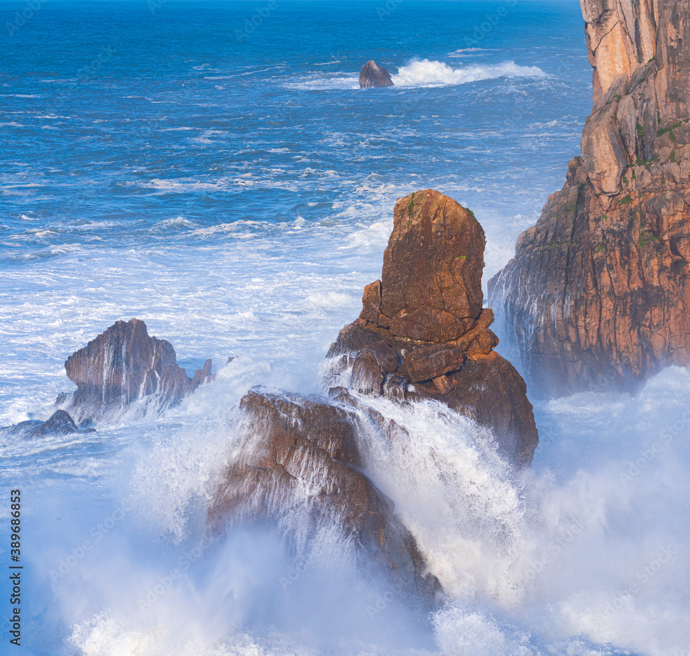 Dusk and waves in the Cantabrian Sea in the surroundings of Costa Quebrada in the Los Urros de Liencres area in the Municipality of Piélagos in the Autonomous Community of Cantabria, Spain, Europe