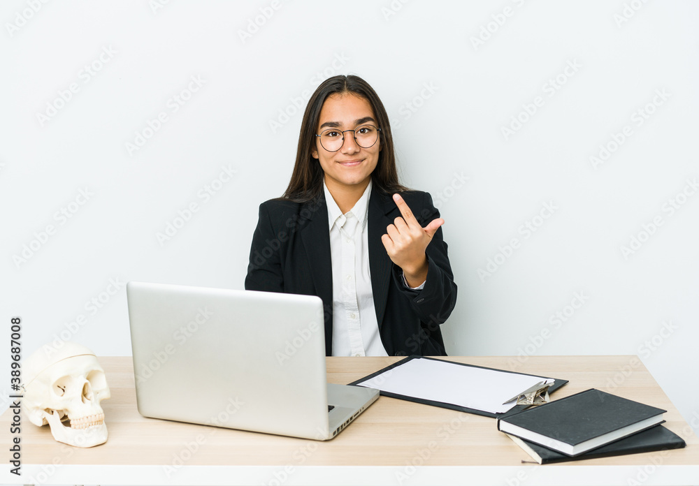Young traumatologist asian woman isolated on white background pointing with finger at you as if inviting come closer. Young traumatologist asian woman isolated on white background pointing with finger at you as if inviting come closer.