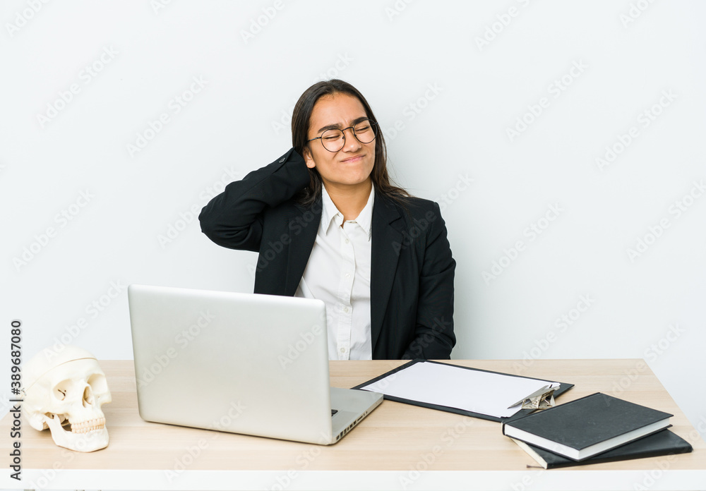 Young traumatologist asian woman isolated on white background suffering neck pain due to sedentary lifestyle. Young traumatologist asian woman isolated on white background suffering neck pain due to sedentary lifestyle.