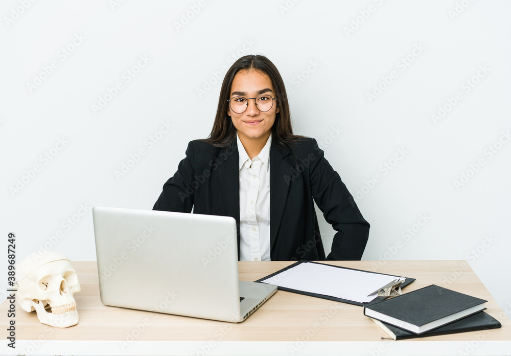 Young traumatologist asian woman isolated on white background confident keeping hands on hips. Young traumatologist asian woman isolated on white background confident keeping hands on hips.