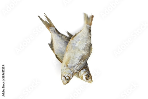 Two dry fish isolated on white background.