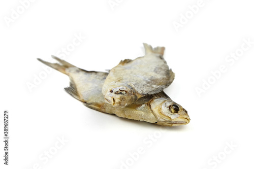 Two dry fish isolated on white background. © mikeosphoto