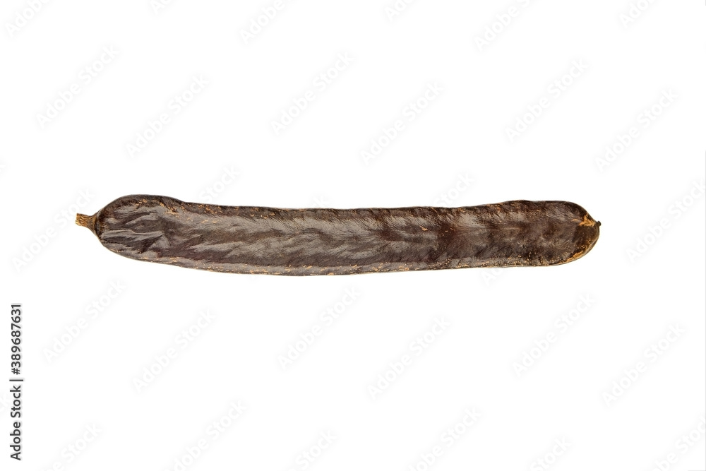 Single carob pod isolated on white background. Single carob pod isolated on white background.