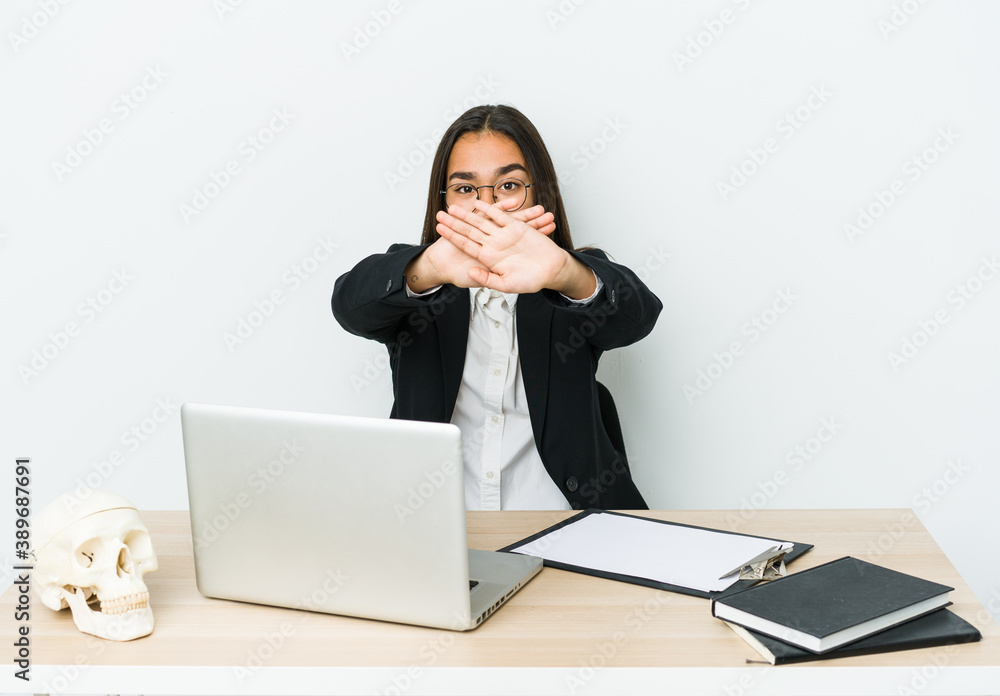 Young traumatologist asian woman isolated on white background doing a denial gesture Young traumatologist asian woman isolated on white background doing a denial gesture