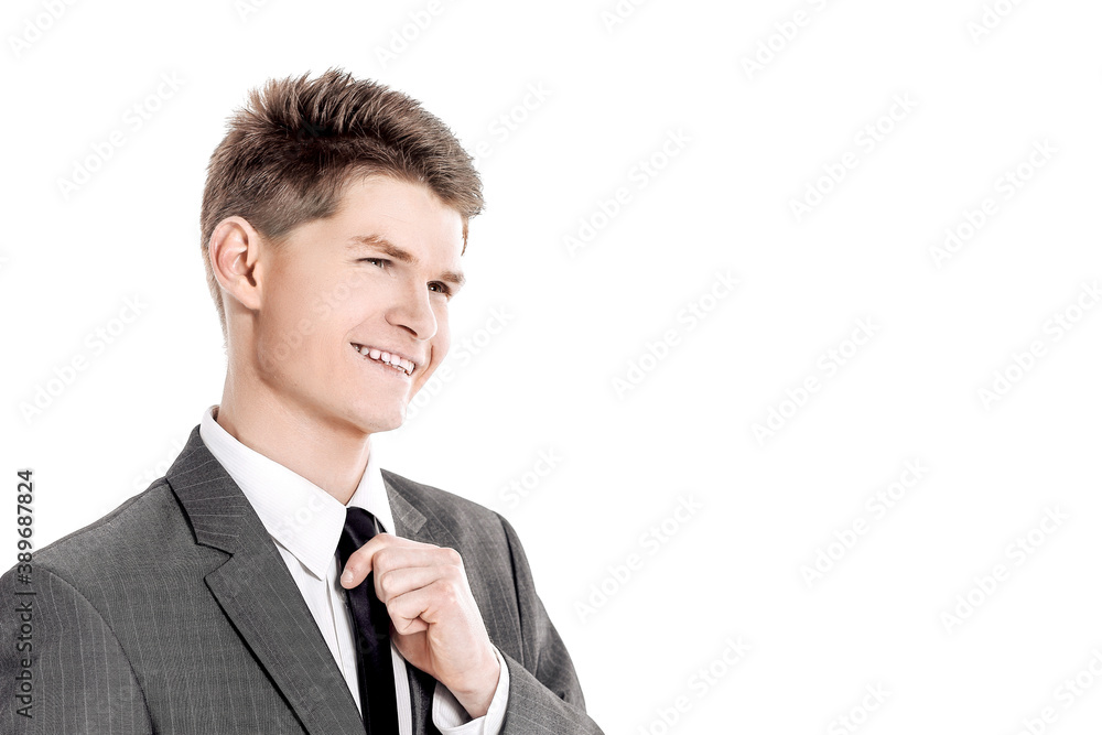 young businessman adjusting his tie.isolated on a white young businessman adjusting his tie.isolated on a white