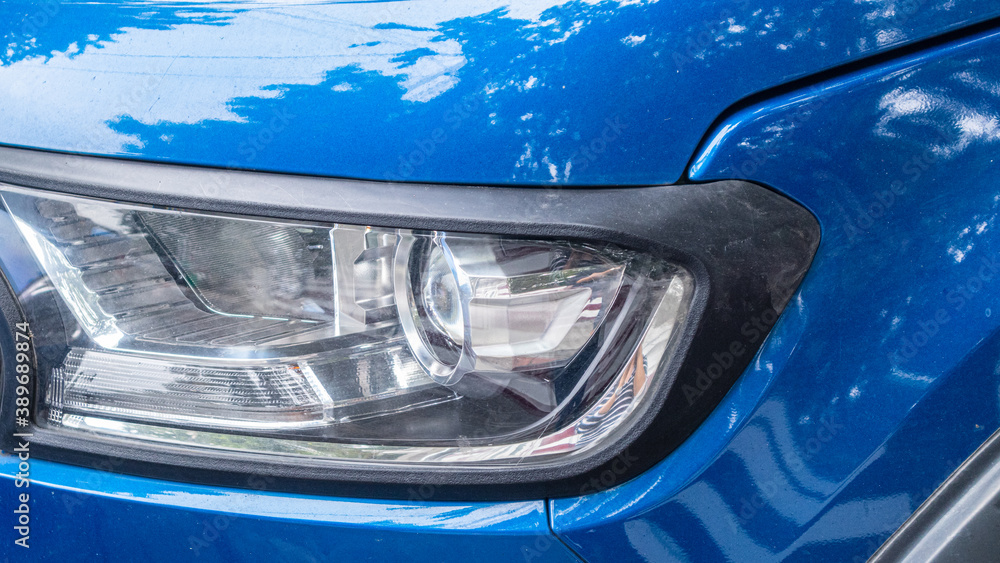 Detail of a luxury Modern blue car headlights. Led car headlights.
