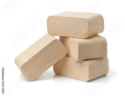 Foto Organic pressed sawdust fuel briquettes