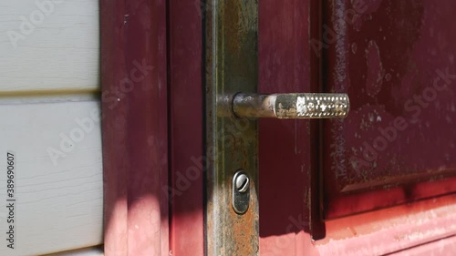 Wallpaper Mural An Old Red Door With An Old Rusty Door Handle Closes Itself. Torontodigital.ca