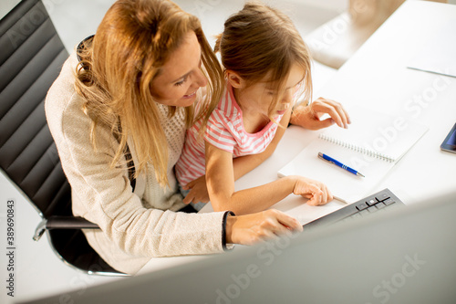 Working mother with her dau...