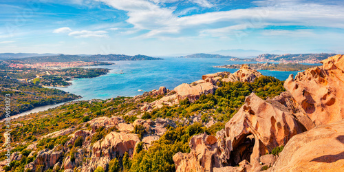 Panoramic spring cityscape of Palau port, Province of Olbia-Tempio, Italy. View from popular tourist destination - Rock of the Bear. Sunny morning scene of Sardinia island. Mediterranean seascape. photo