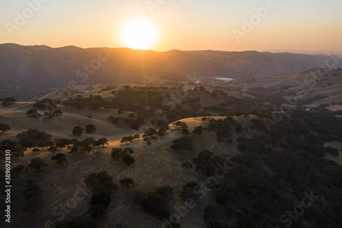 The last light of day shines on the rolling hills in Northern California. These beautiful, golden hills turn green once winter brings seasonal rain to the region.