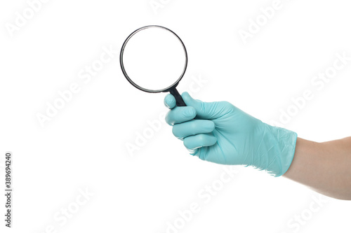 Man's hand holding magnifying glass, close up isolated on white background, copy space for your text. Magnifier for reading