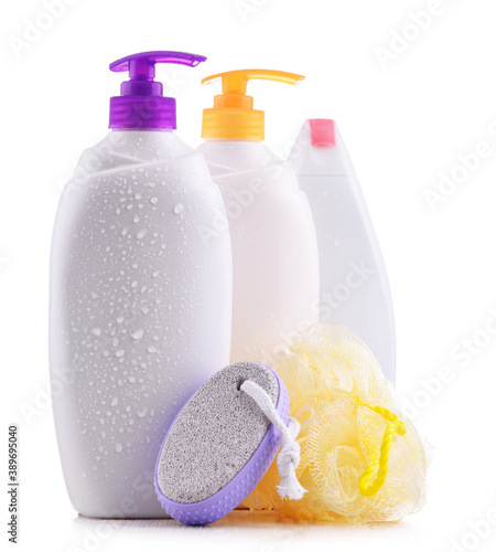 Plastic contaiers of shampoos and shower gels isolated on white photo