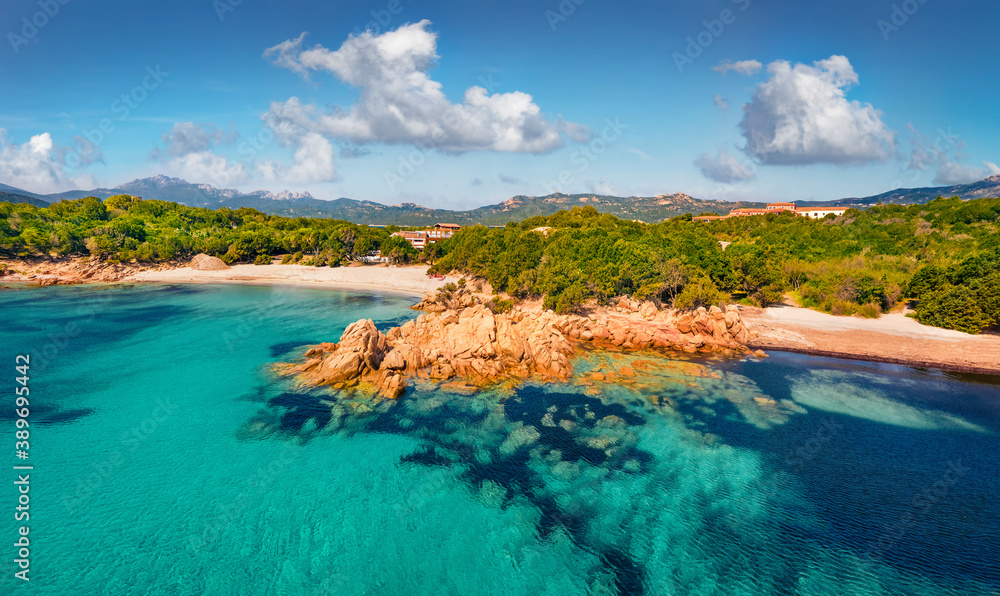 View from flying drone of popular touris deastination - Capriccioli beach, Costa Smeralda. Picturesque summer scene of Sardinia, Italy, Europe. Beauty of nature concept background.