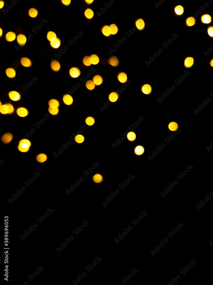 The golden side's or boke on a black background. Merry Christmas and happy New Year. Christmas background. The golden side's or boke on a black background. Merry Christmas and happy New Year. Christmas background.