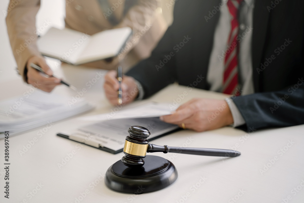 Lawyer working with lawsuit in courtroom, Criminal and judgement concept. Lawyer working with lawsuit in courtroom, Criminal and judgement concept.