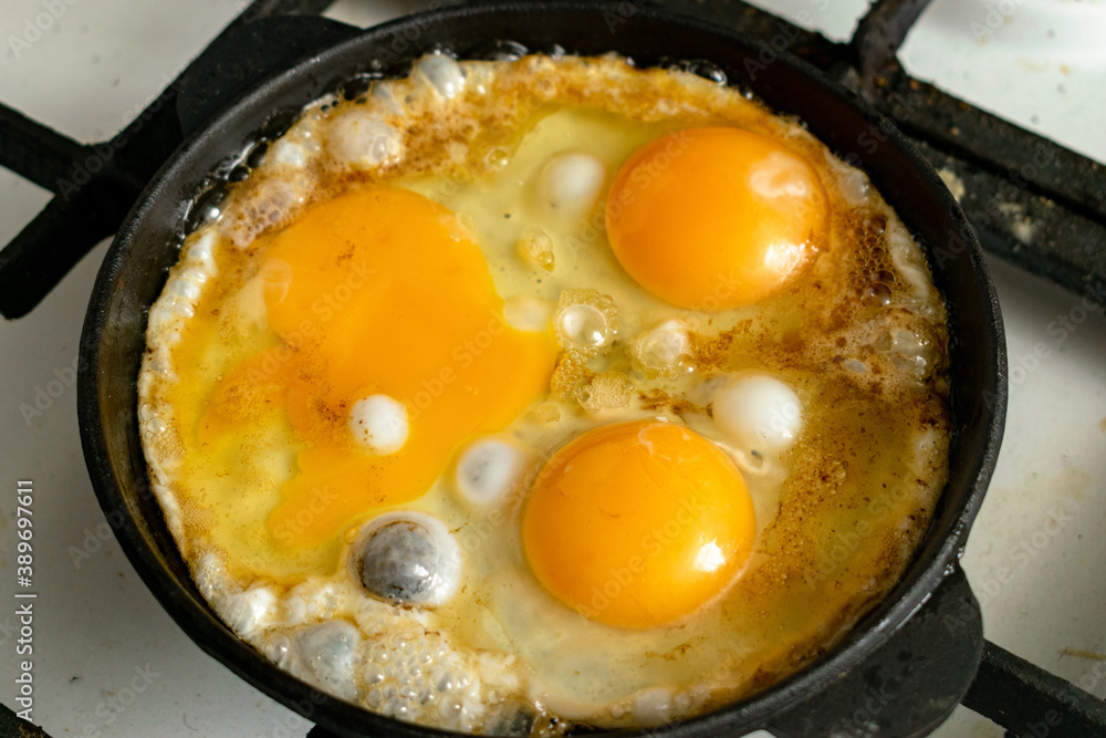casually cooked scrambled eggs in a skillet casually cooked scrambled eggs in a skillet