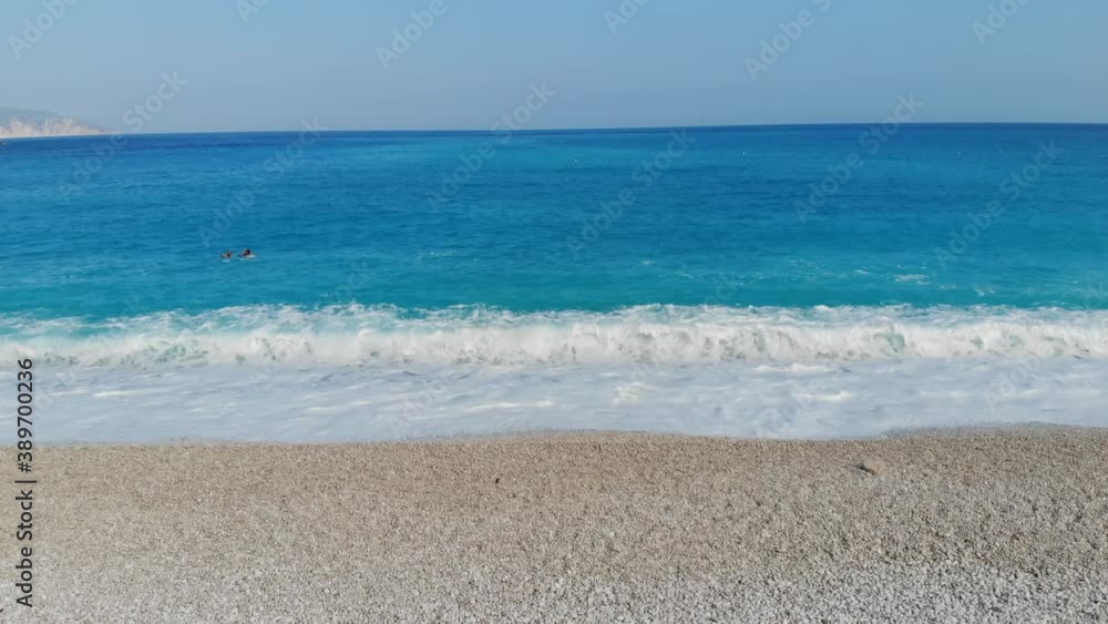 slow motion wave breaking at the beach slow motion wave breaking at the beach