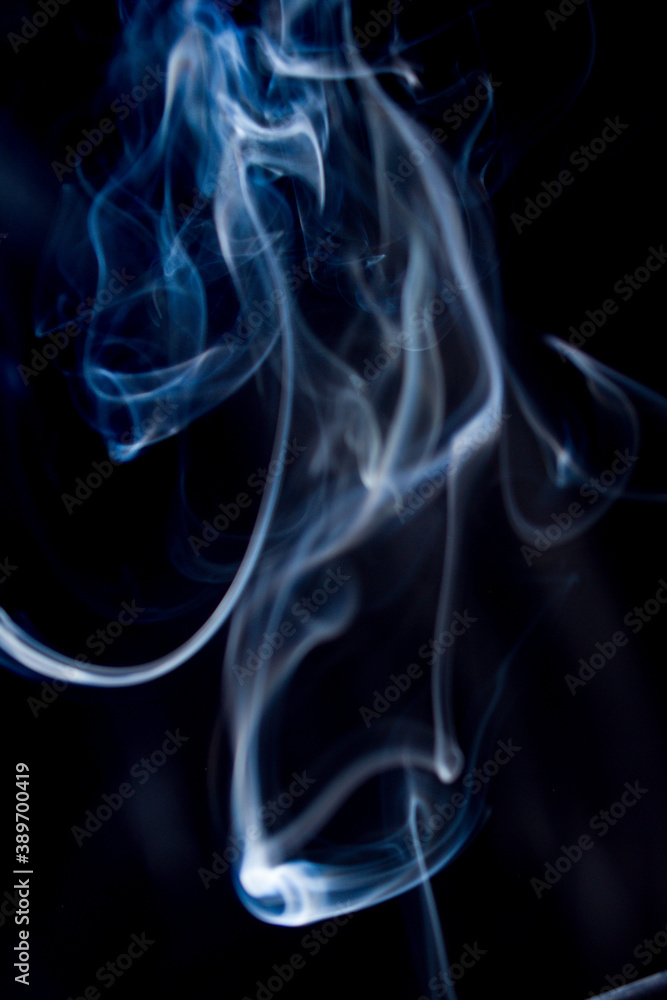 Abstract flowing Blue smoke on dark background wispy Abstract flowing Blue smoke on dark background wispy