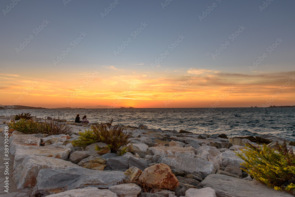 Watching the sunset from Parikia, Paros island Greece. Watching the sunset from Parikia, Paros island Greece.