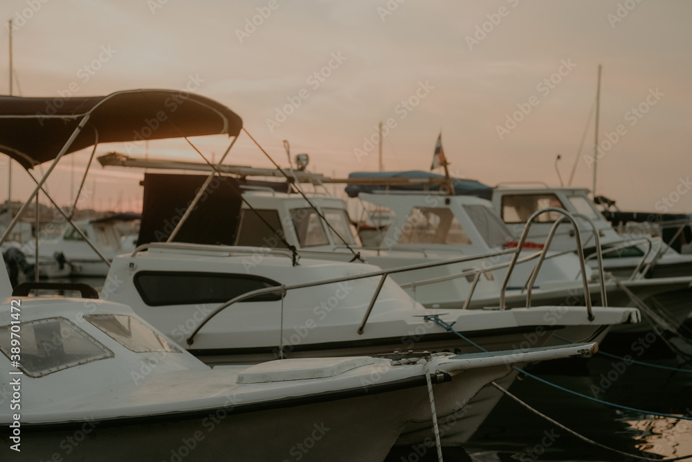 Fototapeta premium There are many yachts, boats and ships at sea. Marina at sunset.