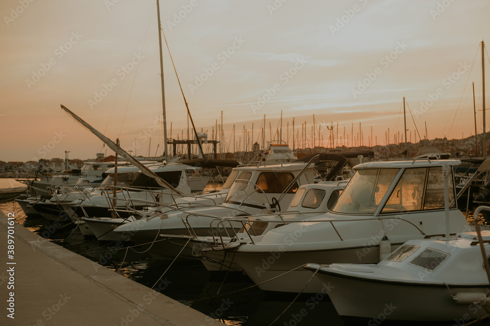 Fototapeta premium There are many yachts, boats and ships at sea. Marina at sunset.