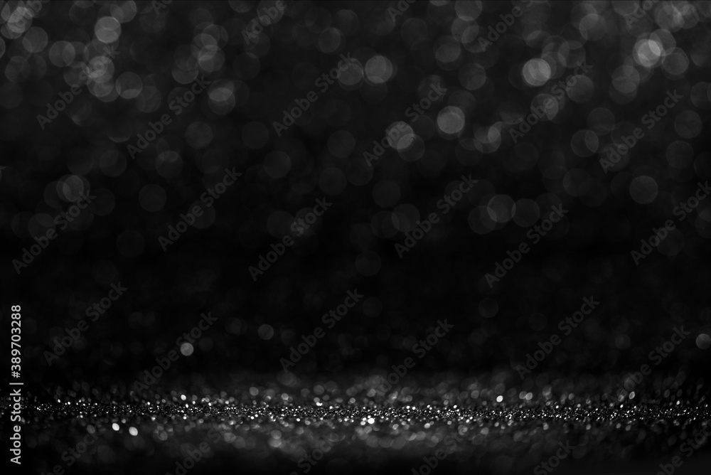 Black friday bokeh background. Elegant dark blur layout design. Silver and black glitter place on table with spotlight. Luxury abstract banner with copyspace. - obrazy, fototapety, plakaty 