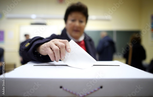 Woman casts his ballot at elections