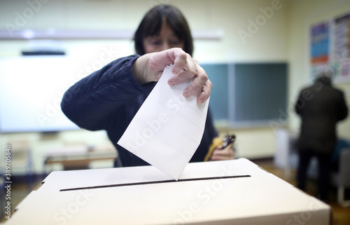 Woman casts his ballot at elections