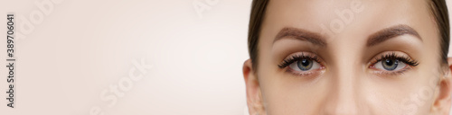 Eyelash Extension Procedure. Beautiful Woman with Extreme Long False Eyelashes. Makeup, Cosmetics. Beauty, Skincare.