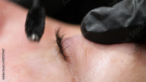 Beautiful young woman  after eyelashes lamination, closeup