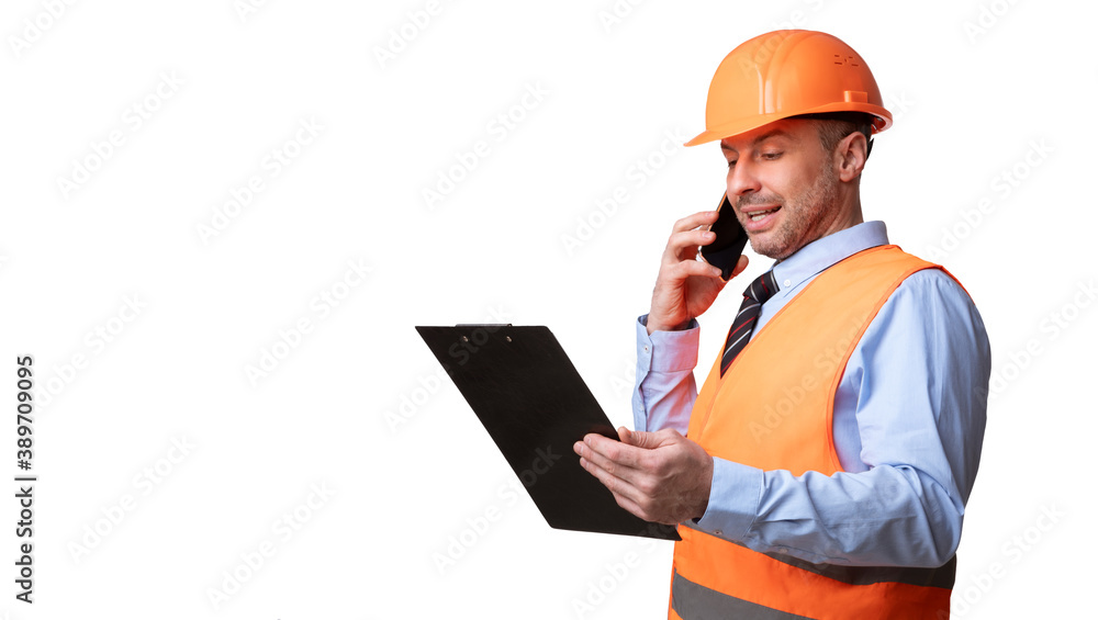 Builder In Uniform Talking On Phone Standing On White Background Builder In Uniform Talking On Phone Standing On White Background