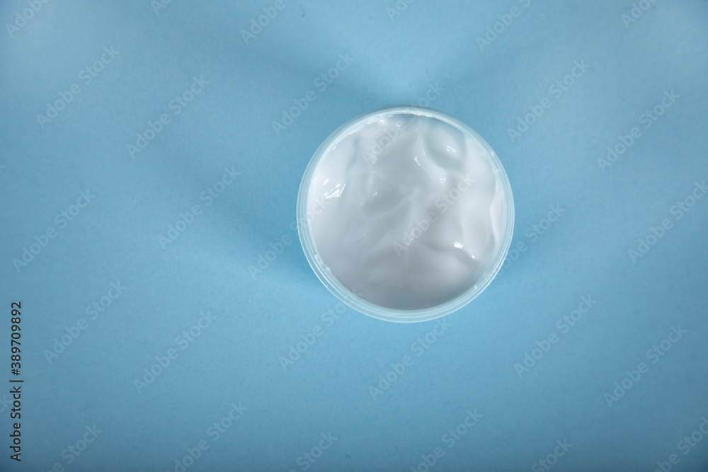 face cream on the blue table face cream on the blue table